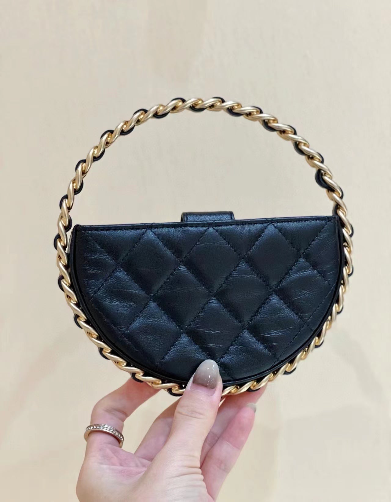 Chanel 2026 Quilted Round Camellia Mini Clutch 16cm Lambskin
