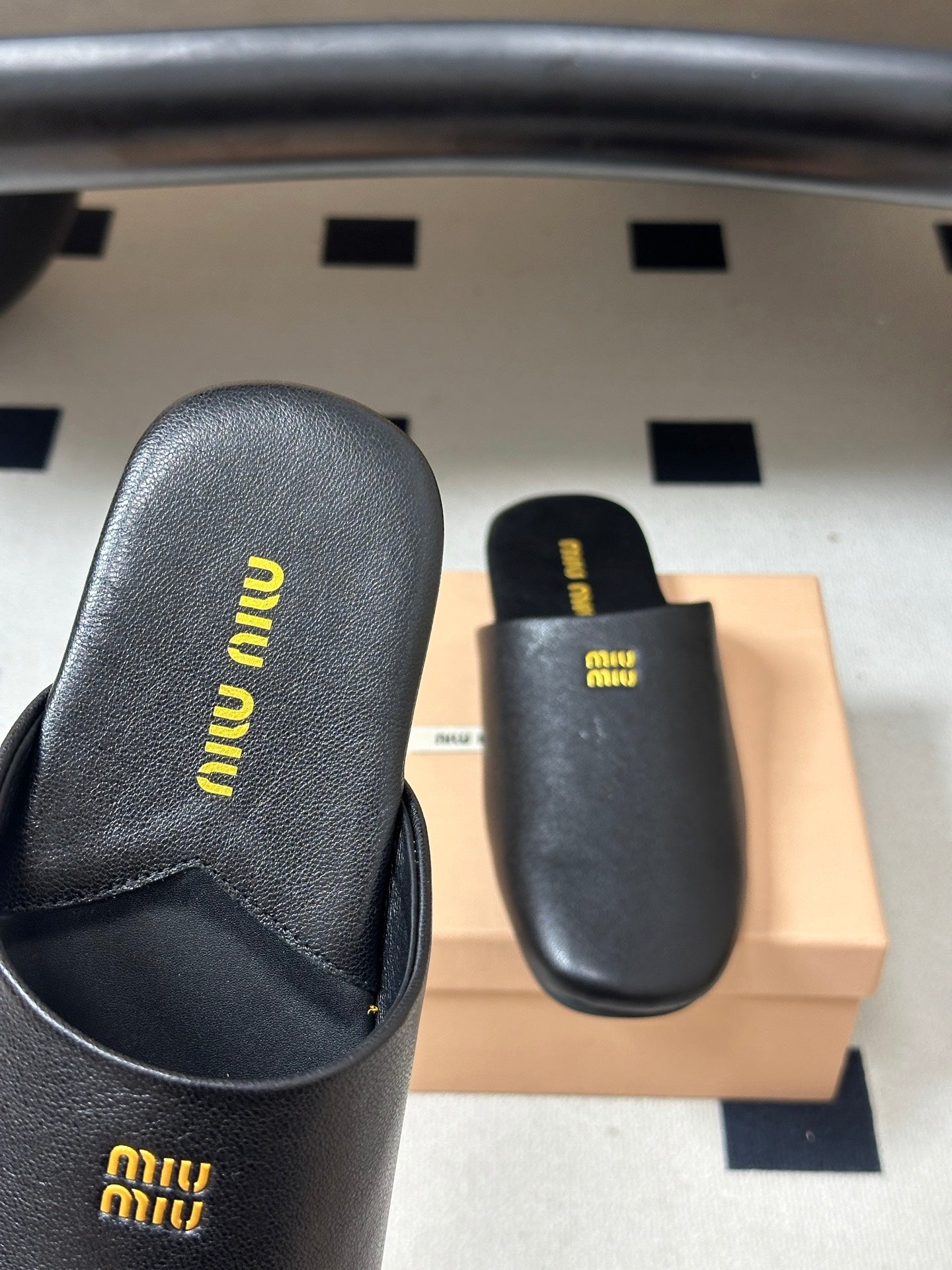 Miu Miu 2026 Flat Closed-Toe Mule Black Cowhide 994104