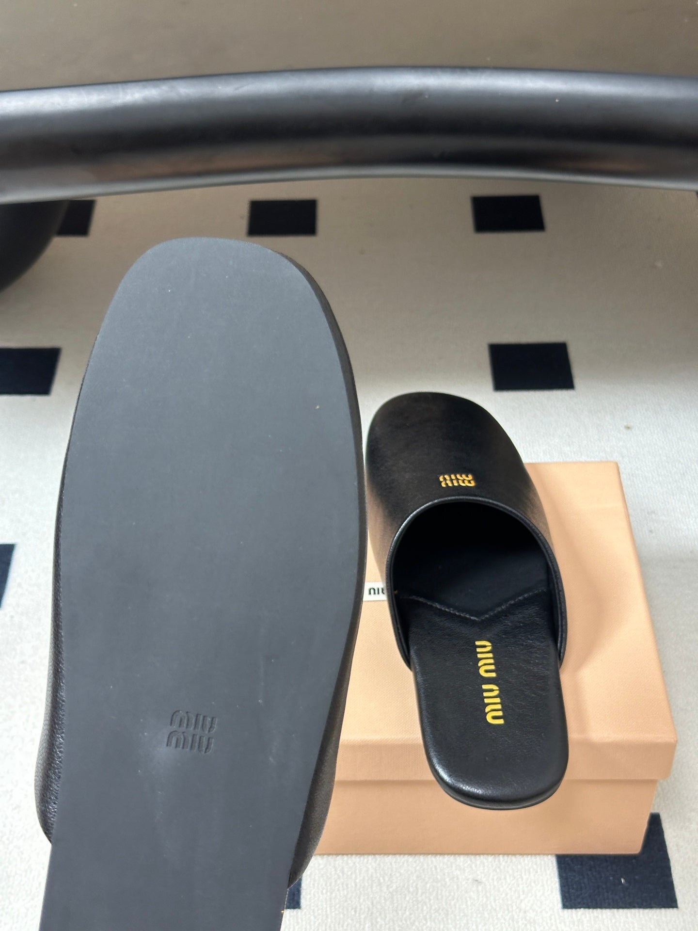 Miu Miu 2026 Flat Closed-Toe Mule Black Cowhide 994104